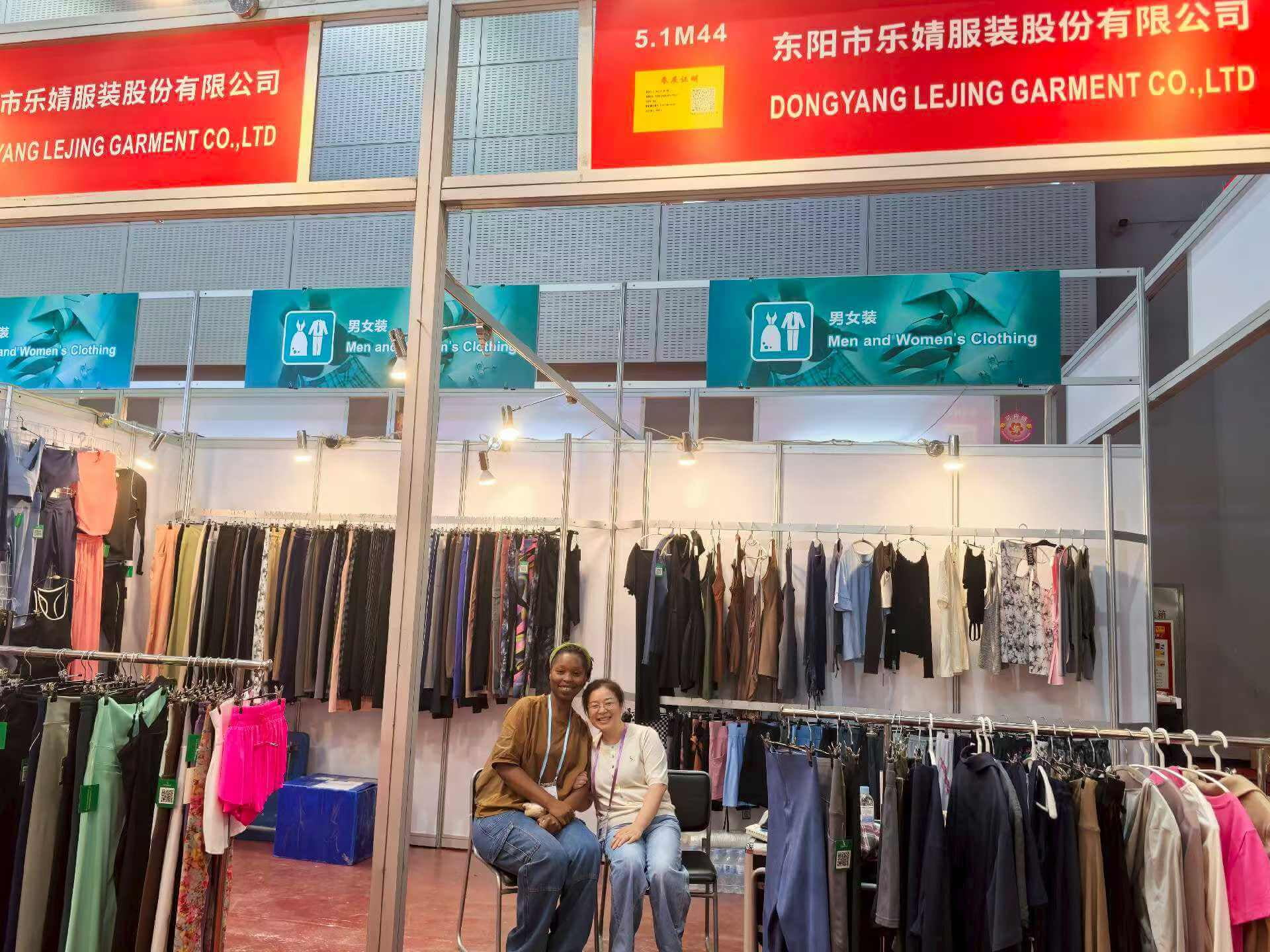 A display of new activewear designs and color trends at a trade show booth