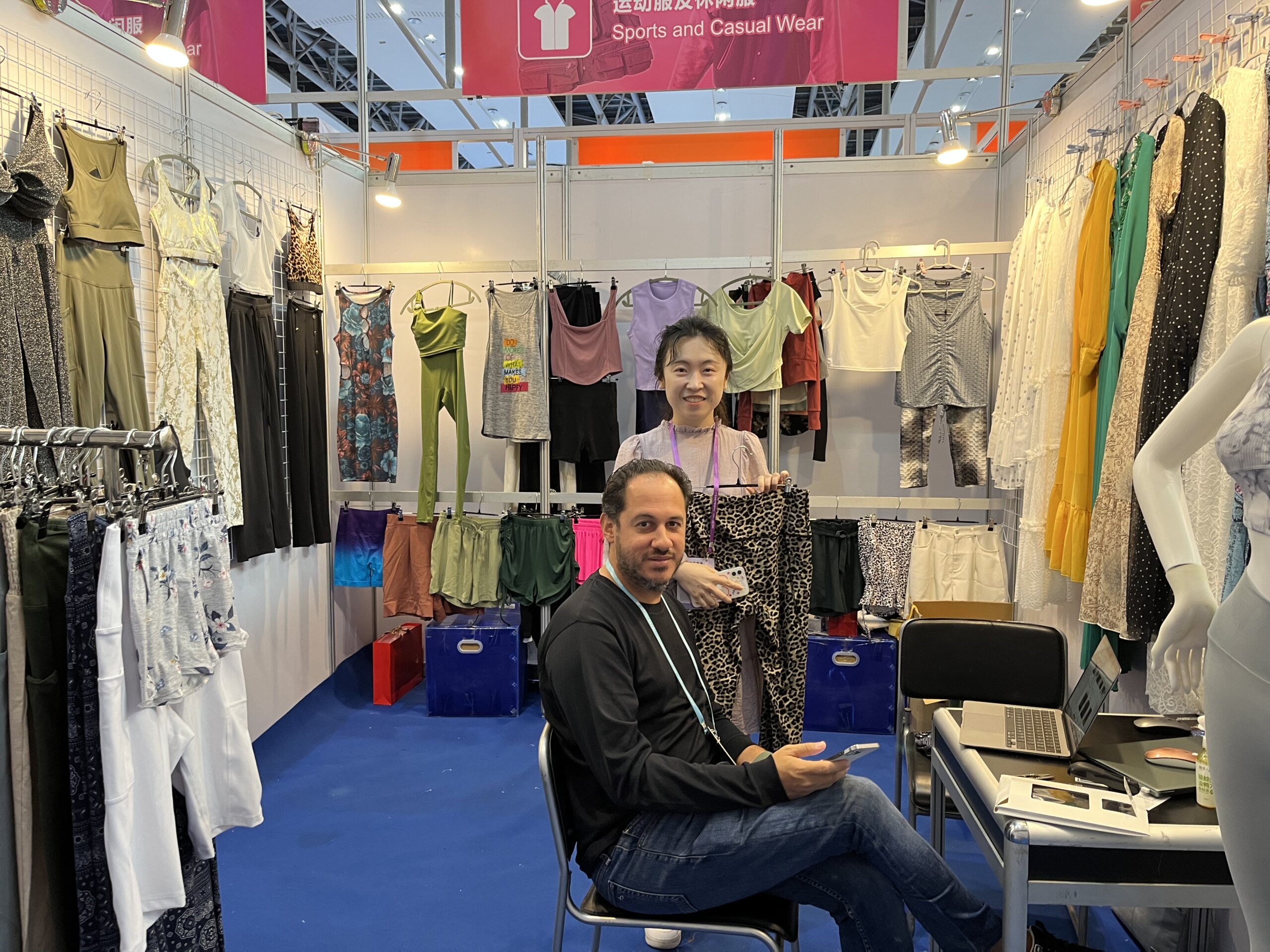 An entrepreneur taking notes while looking at products at a trade fair