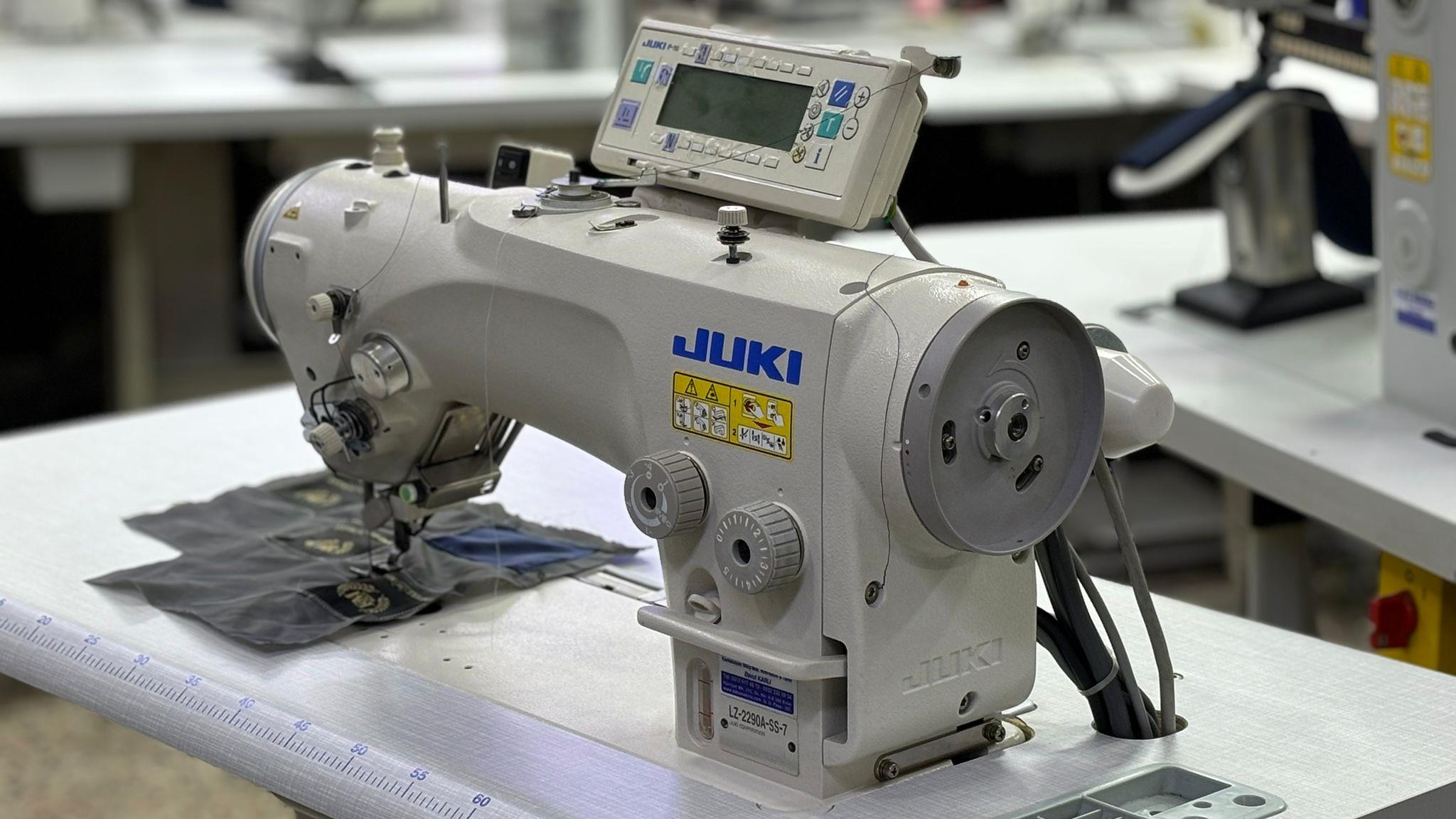 Juki industrial zigzag sewing machine close-up with brand logo visible